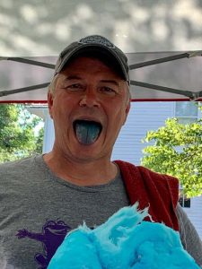 June Jam photo of a man with blue cotton candy