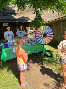 June Jam photo of kids playing a spin the wheel game