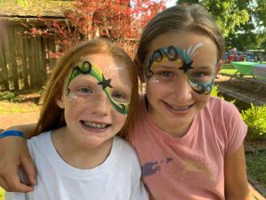 June Jam photo of two girls with face paint