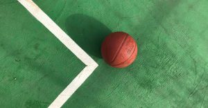 Photo of a basketball on the ground