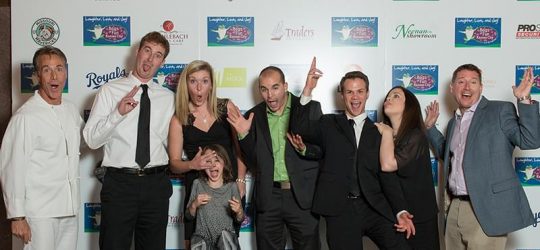 People at an event making silly faces for the camera