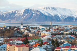 Iceland town with beautiful snow peeked mountains in the background