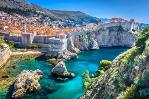 Beautiful sunny day view of the Croatia city along the with crisp blue water at the base of the cliffs.